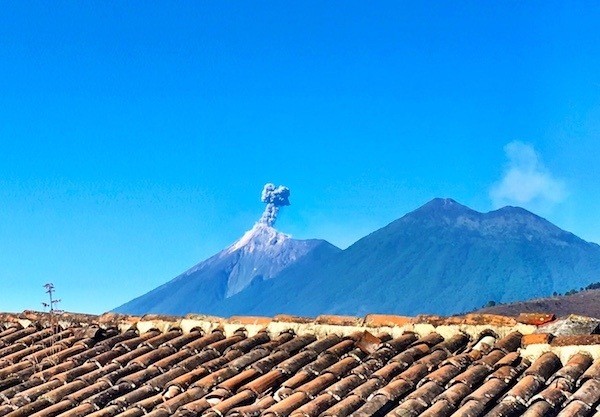 The view of Antigua's volcano Fuego, from the rooftop of Posada San Sebastian
