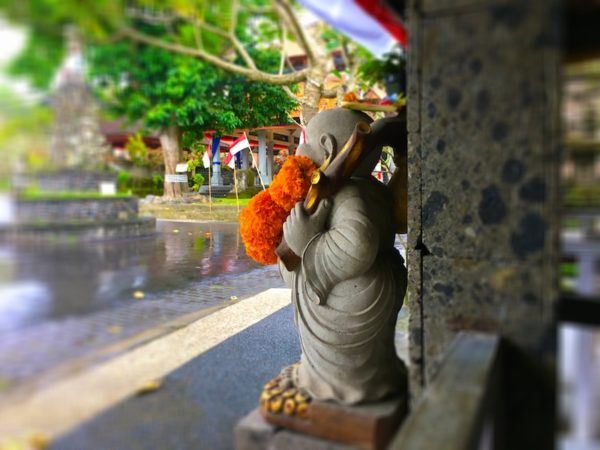 Buddha with fresh flowers