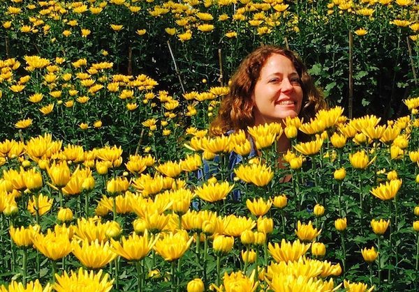 enjoying life in yellow flowers, while learning various truths about travel