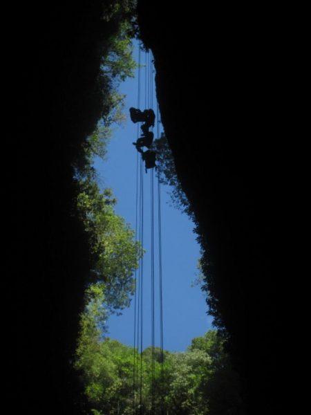 abseiling into a cave in Waitomo New Zealand