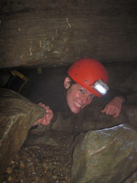 Nora Dunn, The Professional Hobo going through a tight squeeze inside a New Zealand cave