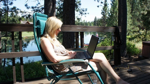 Friday, Hannah of LovePlayWork sitting on the deck catching up with some work