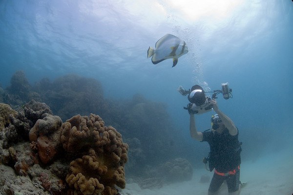 Gary Arndt photographing underwater Great Barrier Reef