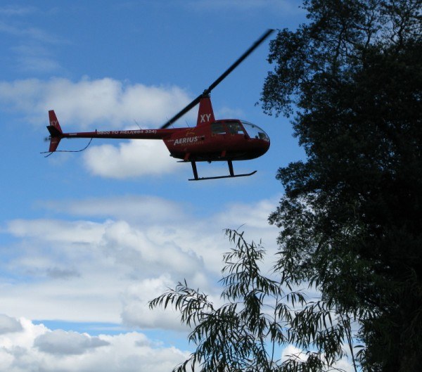 the Kaitiaki Adventures red helicopter which delivered us to our heli-sledging spot in New Zealand