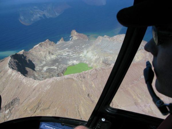 Circling around the crater of White Island in a helicopter