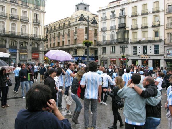 random celebrations and dancing in a square in Madrid
