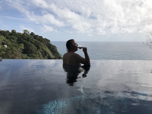 Marc Smith with a glass of wine in his private infinity pool at the Paresa Phuket