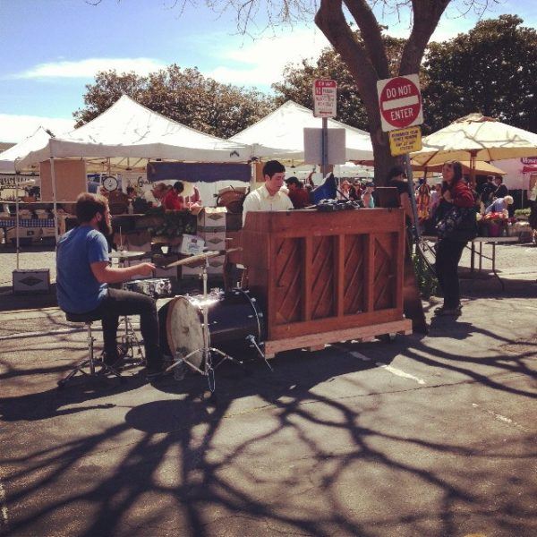 drums and piano being played at the market
