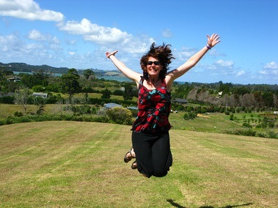 jumping for joy in New Zealand after four years of full-time travel