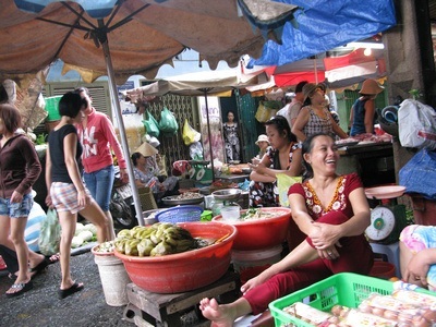 market stall owner in Vietnam street market