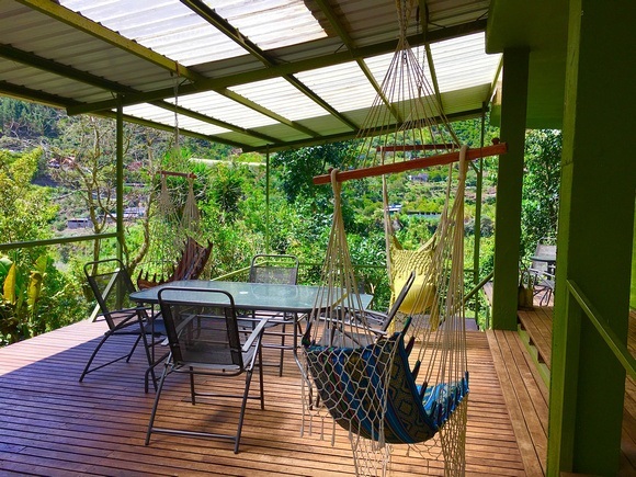 terrace at la casa verde with hammock chairs and covered porch area