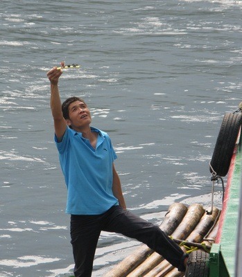 ...and selling little men on bamboo rafts selling stuff...