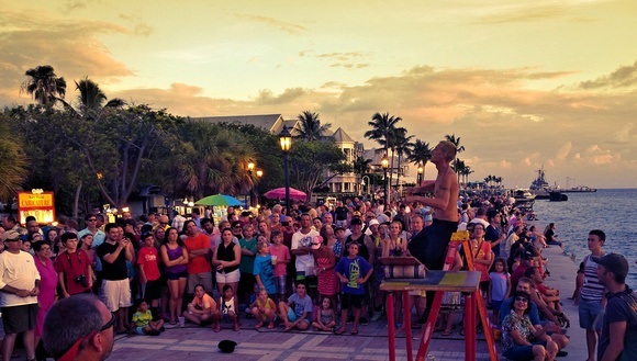 street performer performing to a crowd during sunset in Key West