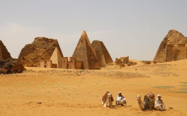 pyramids of Egypt with camels in foreground; photo by Johnny Ward of OneStep4Ward
