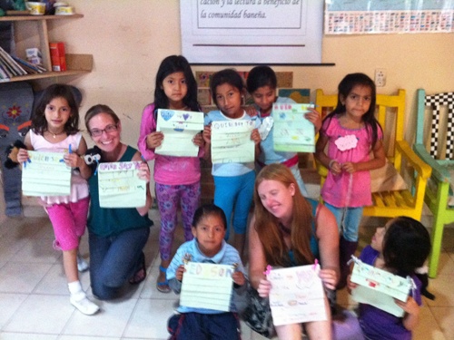 Alisha of Small World Pursuits spending time with kids from the bib in Ecuador